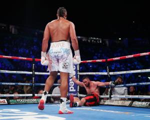 Joseph Parker is knocked down by Joe Joyce during the Vacant WBO Interim World Heavyweight...