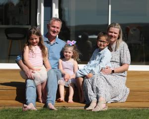Waitaki Mayor Gary Kircher celebrates winning his fourth term with wife, Kerry, and three...