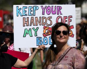 An abortion rights protester holds a sign during a rally in Los Angeles, California. Photo: Reuters