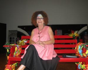 Retiring teacher Sally Lloyd receives a rousing farewell at a special assembly yesterday to mark...