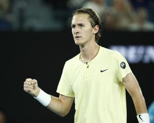 Sebastian Korda celebrates after winning a point during the third round singles match against...