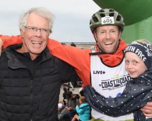 John Walker greets his son, James, and grandson, Harry (then 9), at the Coast to Coast in 2021....