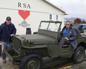 Owner Dwain Devereux  (right) and West Otago RSA president Colin McDonald put a restored 1942...