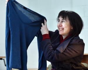 Fiona Jenkin, of Stitch Kitchen, with a merino top darned at a Dunedin repair cafe. PHOTO: ODT FILES