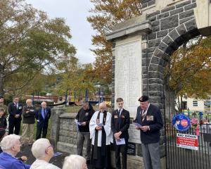 Leading the rededication ceremony for the North East Valley War Memorial Archway were (from left)...