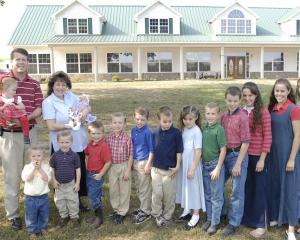 The Duggar family: parents Michelle and Jim-Bob Duggar and some of their 19 children — nine...