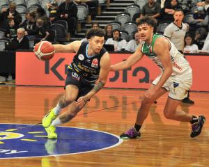 Otago Nuggets import JaQuori McLaughlin looks to move the ball through the court during the...