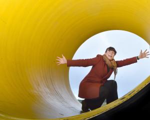 Alanta Colley stands in part of an ocean outfall pipe at the Tahuna wastewater treatment plant,...