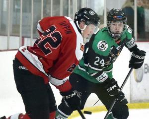 Dunedin Thunder forward Jack Lewis (right) tussles with Canterbury Red Devils defenceman Luke...