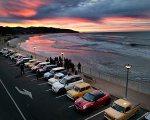 Cars in the mini rally pose on Haast bridge before departing north and south to head home. Photos...