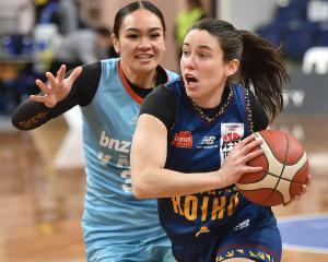 Southern Hoiho point guard Paige Bradley gets around  Northern Kāhu guard Elianna Tuaiti at the...