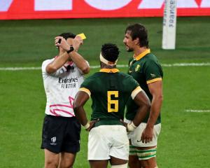 Kiwi referee Ben O’Keeffe shows Springbok Eben Etzebeth (right) a yellow card during the...