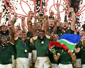 Springboks captain Siya Kolisi lifts The Webb Ellis Cup after South Africa won a record fourth...