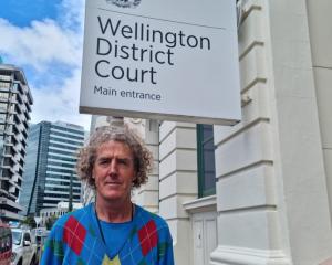 Peter Wham was arrested after putting up posters in Wellington. Photo: RNZ