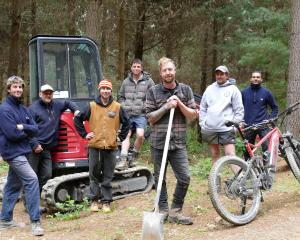 Lawrence Bike Club (LBC) members and Flux Trail trail-building consultants (from left) Jacob O...