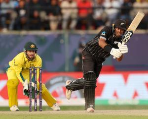 Black Cap Rachin Ravindra clips the ball into the legside during a Cricket World Cup match...