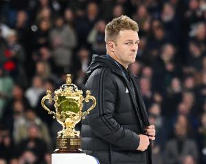 Sam Cane walks past the Webb Ellis trophy after the All Blacks lost the Rugby World Cup final to...