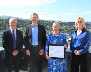 Ross Buckley and Trish Oakley flank Institute of Directors Otago-Southland branch emerging...
