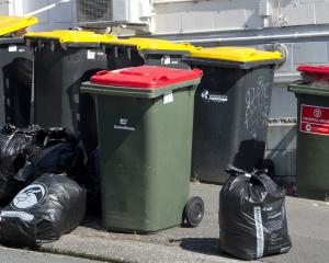 A mix of bins and bags await emptying and collecting in High St, Dunedin, yesterday. PHOTO:...