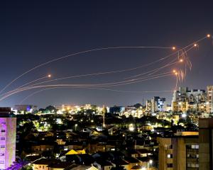 Israel's Iron Dome anti-missile system intercepts rockets launched from the Gaza Strip, as seen...