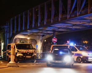 Police at the scene near the Bir-Hakeim bridge in Paris. Photo: Reuters