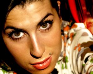 Amy Winehouse with trademark eye makeup.