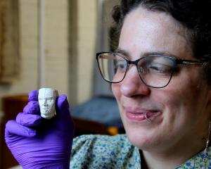 Lawrence Tuapeka Museum’s Jess Weichler holds a rare pipe bowl displayed at the recent Lost and...