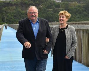 Dunedin surgeon Dick Bunton walks with wife Lynley, after he was awarded an ONZM for services to...