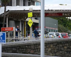 Armed police guard the entrance to Christchurch Hospital on March 15, 2019. Photo: Getty Images