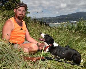 Summit Contracting Ltd managing director and owner Joe Hughes and his possum-hunting hound Sophie...