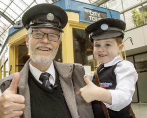 Tram driver Barry Corbett and his 4-year-old grandson Daniel Stewart. Photo: Geoff Sloan