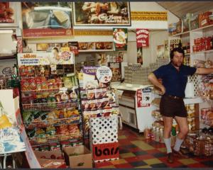 Alan Dick minds the shop in his Discount Foods store, in Cromwell, in November 1984. The building...