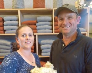 Esta and Tim Naylor hold their Romney lamb’s wool, which has been used to create the jerseys in...