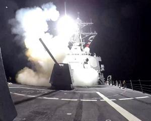 A Tomahawk missile is launched from the US destroyer USS Gravely against what the military...