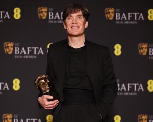 Cillian Murphy poses with his award for Leading Actor for "Oppenheimer" during the 2024 British...