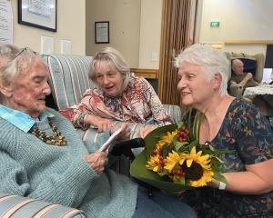Margaret Reid receiving 100th birthday wishes from local RSA support adviser Diane McIrvine,...