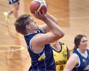 Otago rugby player Harry Taylor, representing team blue, goes for the hoop in the Sport Otago All...