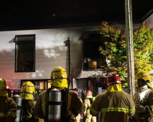 Firefighters at the scene in Christchurch last night. Photos: NZ Herald