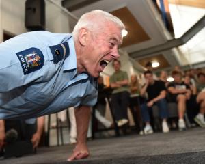 Senior Constable John Woodhouse, of Dunedin, completing his 80th push-up in a competition with...