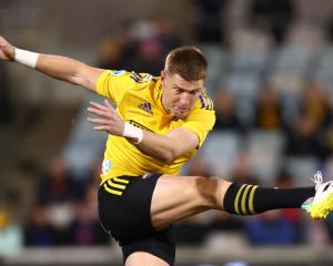 Jordie Barrett of the Hurricanes kicks ahead during a match last year. Photo: Getty Images 