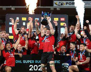 The Crusaders celebrate with the Super Rugby trophy. Photo: Getty Images