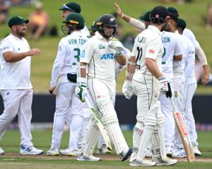 New Zealand's Tom Latham walks off after being dismissed by South Africa's Dane Piedt. Photo:...