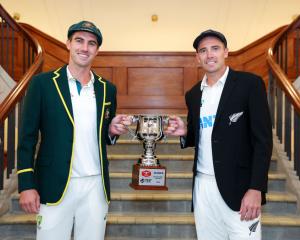 Australia captain Pat Cummins (L) and New Zealand captain Tim Southee pose with the test series...
