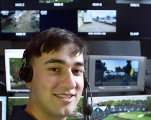 Virtual Eye graphics operator Jack Wylie showcases his virtual golf course model at the company’s...