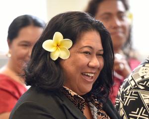 Pacific professor of psychology Siautu Alefaio reacts to a cultural welcome from members of the...