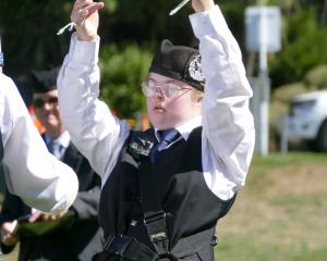 City of Dunedin Juvenile Pipe Band drummer Emily Franklin, 17, in action during her band’s...