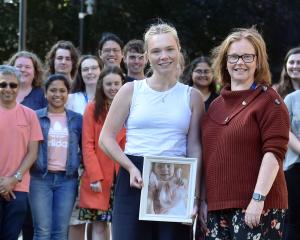 Holding a picture of her daughter Claire, Sally Aldrich, of Dunedin,  joins Brain Health Research...