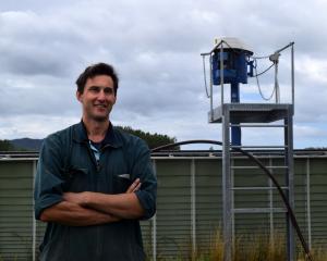 Dairy farmer Michael Souness and the Kliptank effluent tank on Inch Clutha. PHOTO: SHAWN MCAVINUE