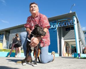  Jarrod Tumai with his dog Poto, who is no longer allowed at council pools. Photo: John Borren...