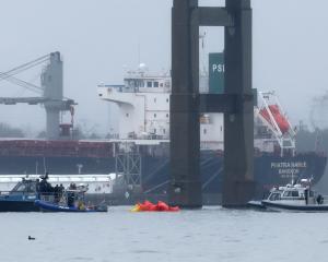 Emergency dive teams work at the scene of the collapsed bridge in Baltimore Harbor. Photo: Reuters
